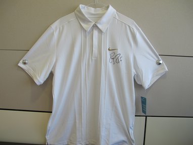 White T-shirt signed by world-renowned tennis player Roger Federer.