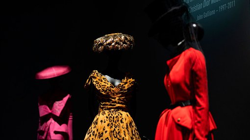 Three vibrant looks by John Galliano for Dior, featuring a leopard-print dress in the centre