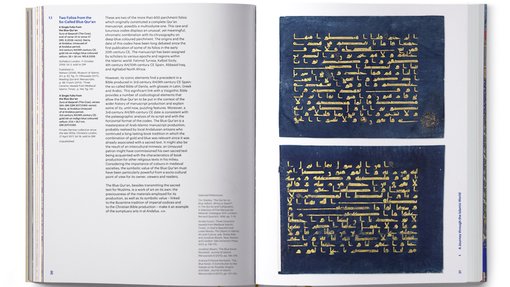 Two open pages of a book showing pages of the Blue Quran with text