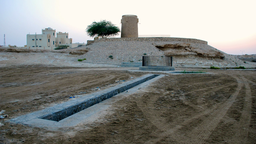 The Ain Hileetan well seen at dawn with the sun rising in the background