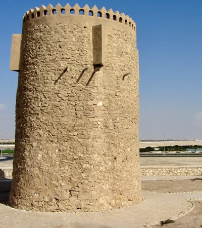 The Al Khor stone tower, Qatar, seen with a bright blue sky behind it