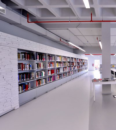 Book shelves with colourful books in Mathaf's library