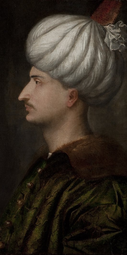Profile of a man wearing a white turban.
