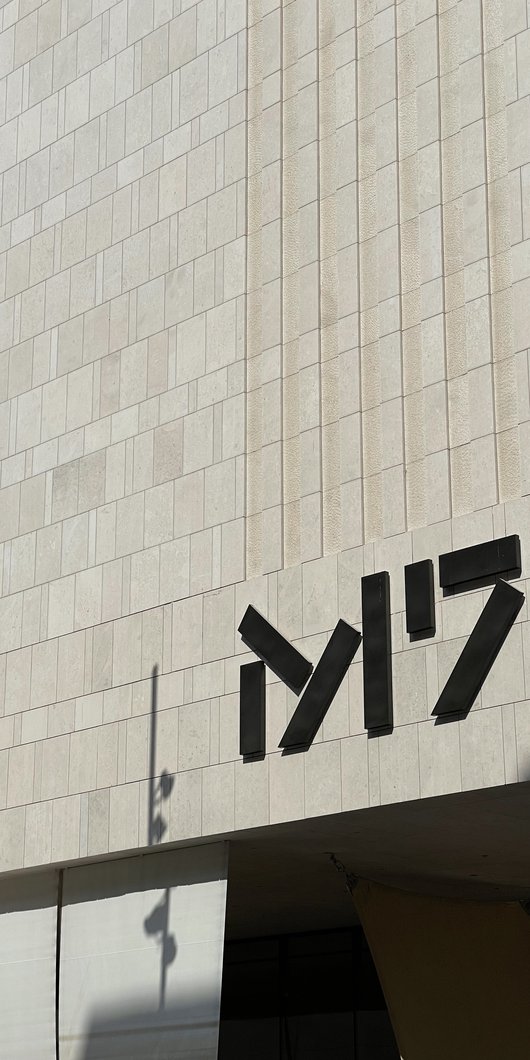 Exterior view of M7's building showing logo signage.