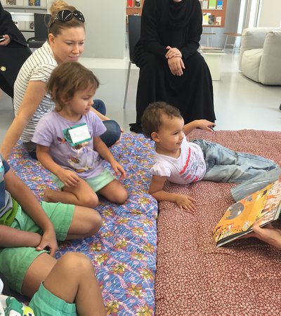 Children and their parents at story time