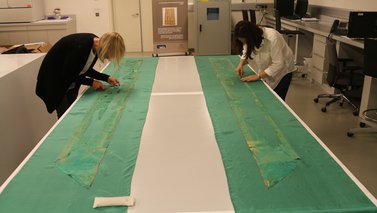 A team of experts restoring the Baroda Carpet